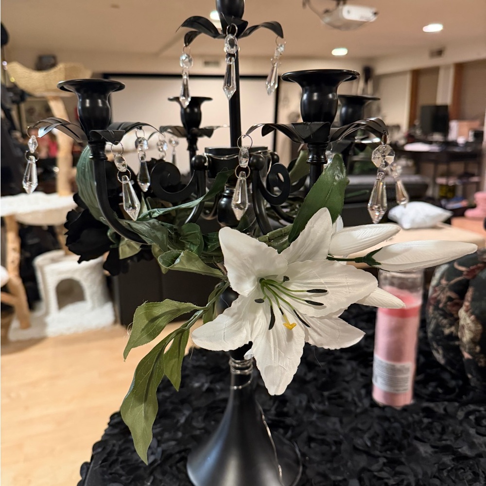 Elegant Black Candelabra with White Floral Accents